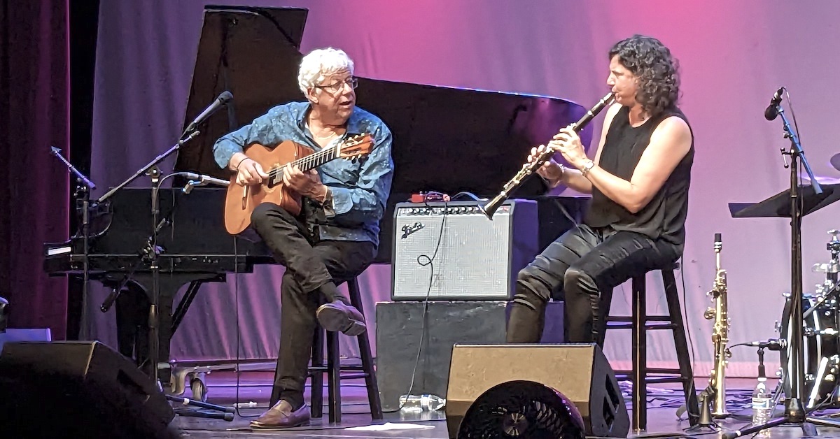 Anat on clarinet and Romero on guitar. They look at each other as they play