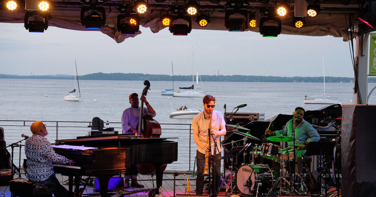 The quartet on stage, with Lake Mendota behind