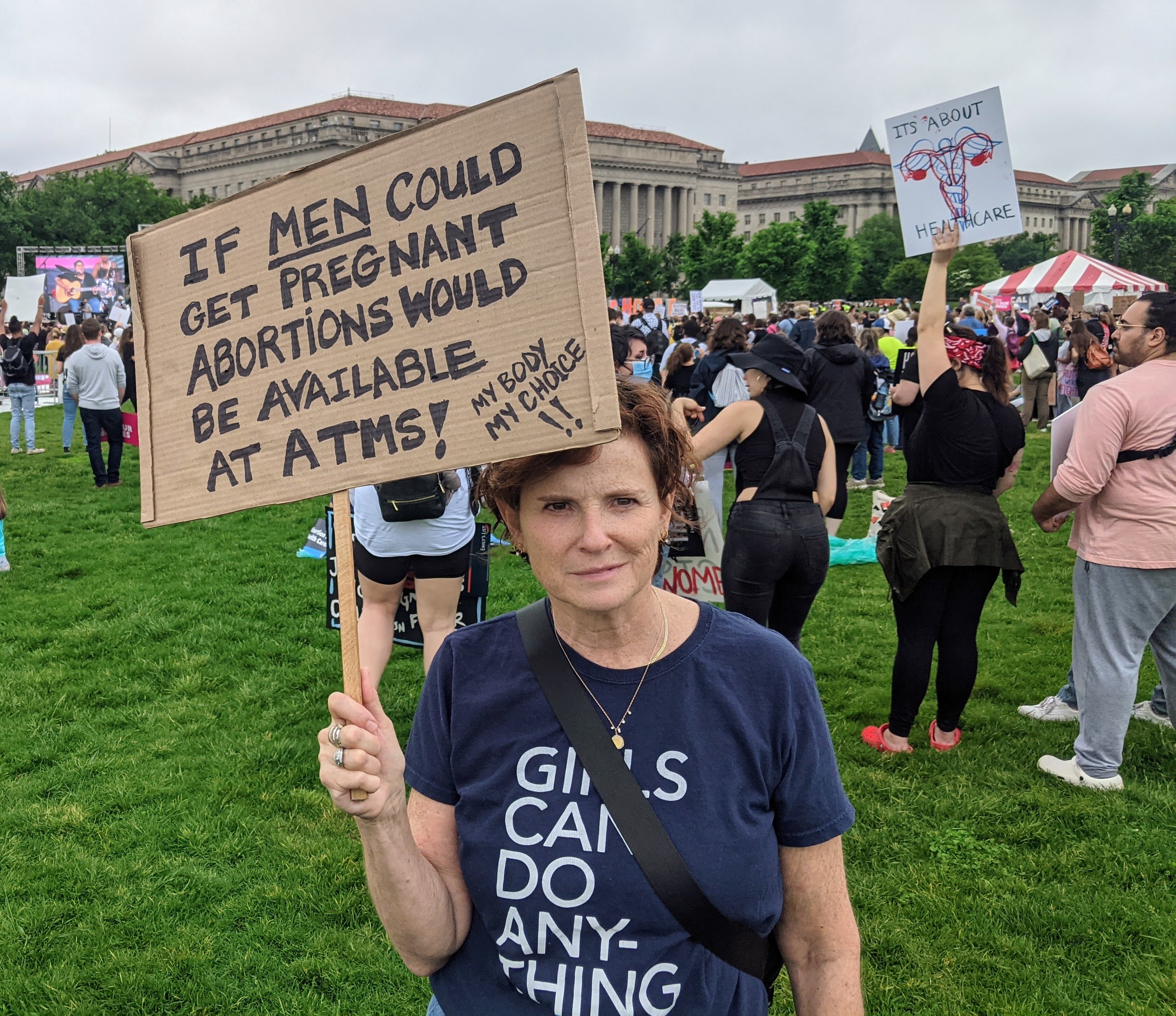 &lt;# Audrey carrying a sign at the anti-Abortion march #&gt;