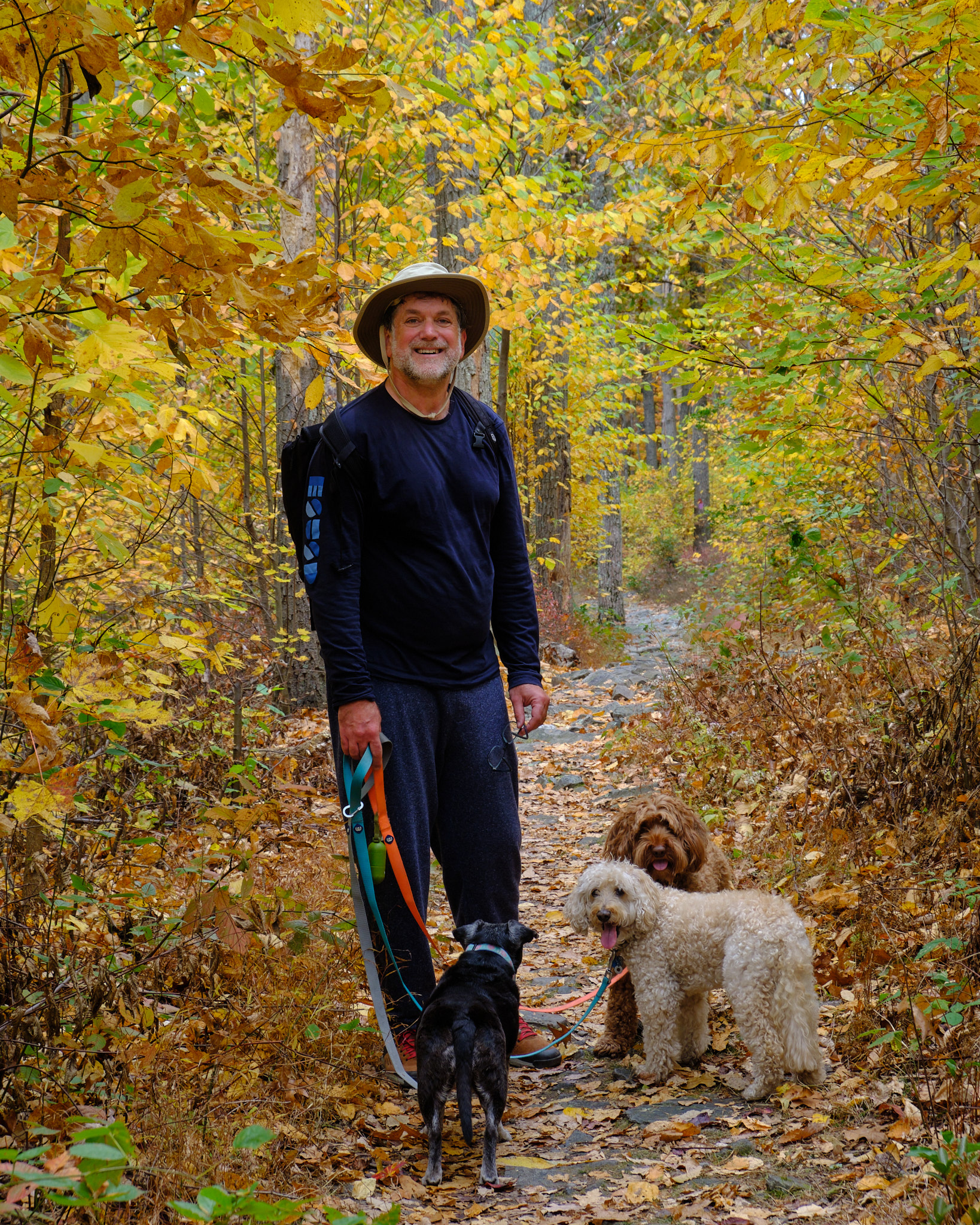 &lt;# Jeremy with dogs in fall leaves #&gt;