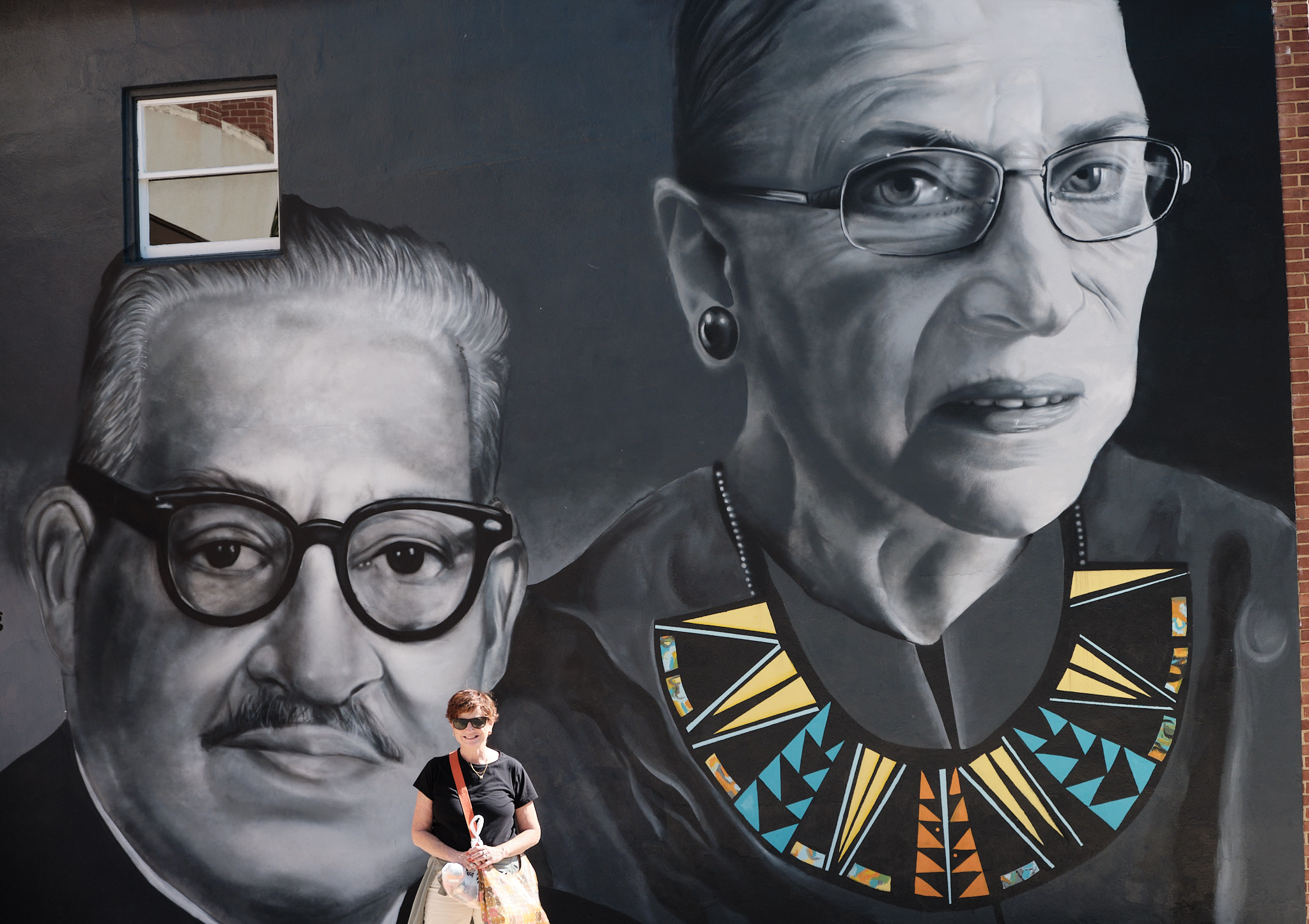 &lt;# Audrey in front of mural with Ruth Bader Ginsburg and Thurugood Marshall #&gt;