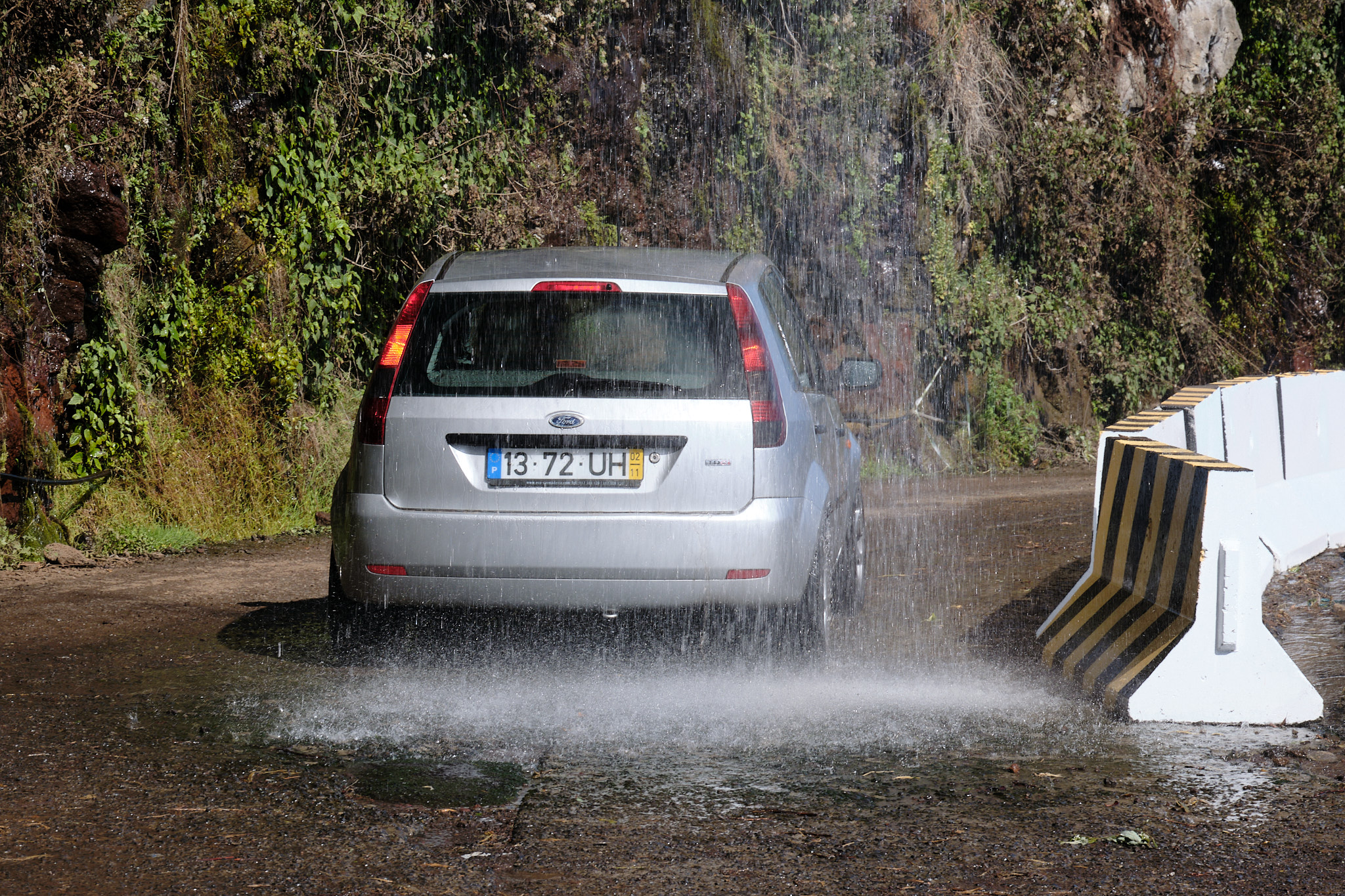 &lt;# car going through waterfall #&gt;