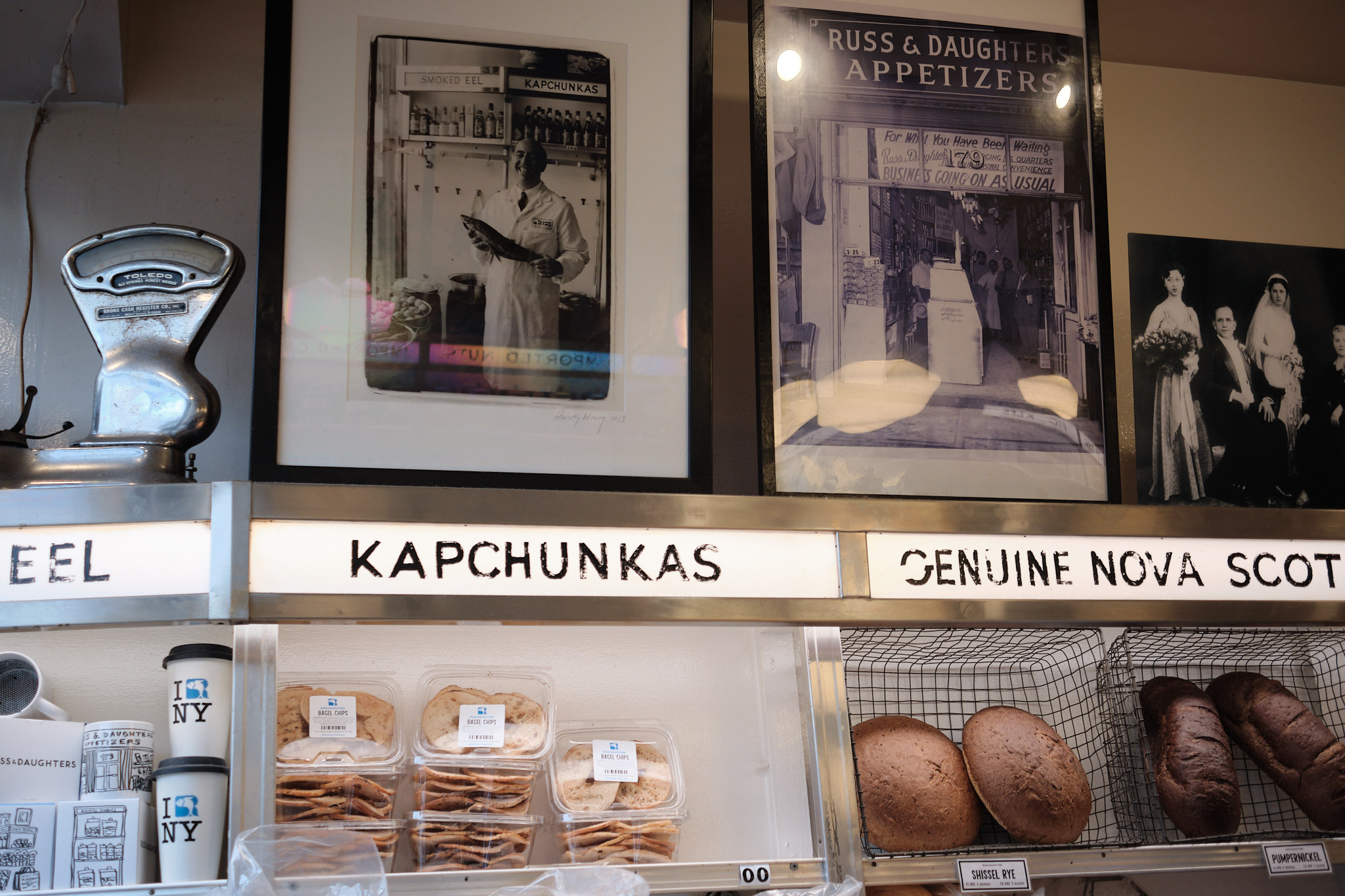 &lt;# shelves in Russ and Daughters with old photos and an old scale #&gt;