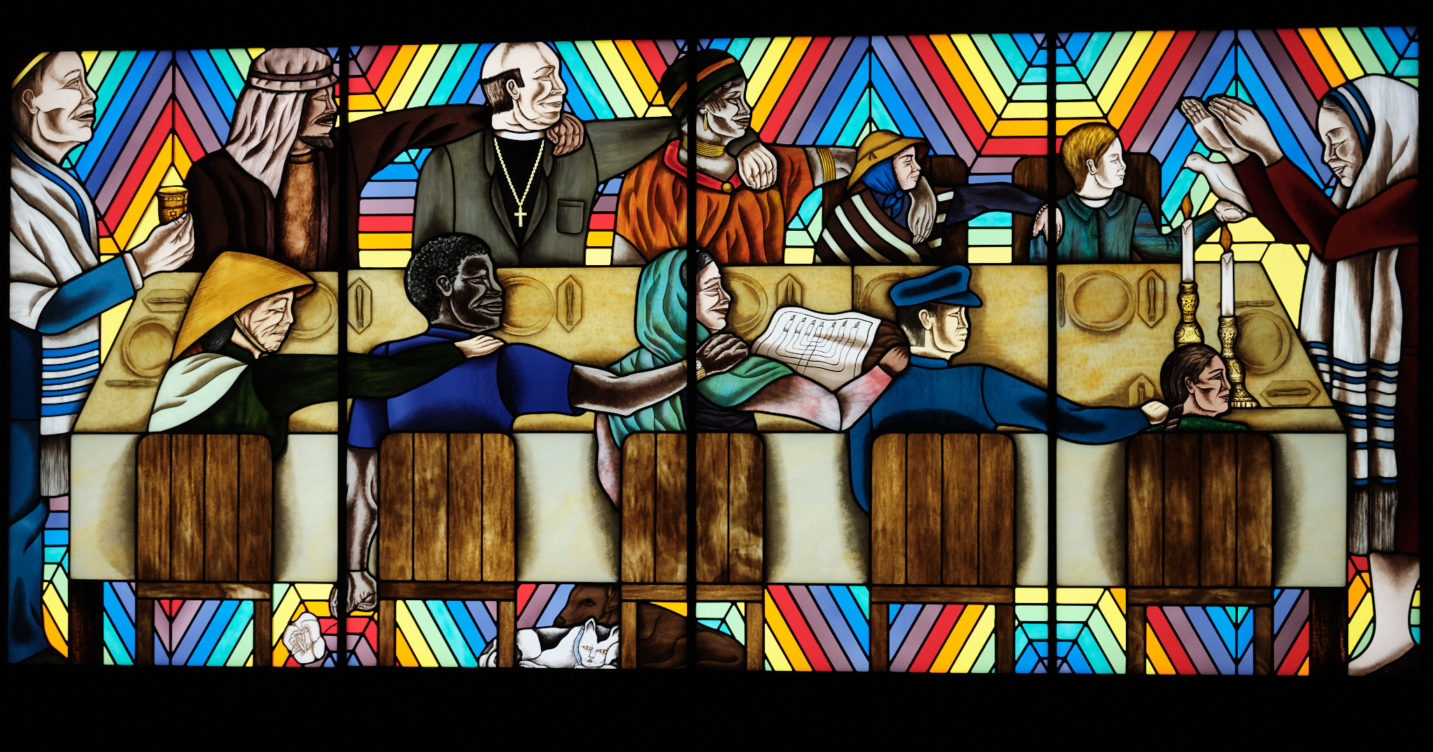 &lt;# Stained glass art called the Rainbow Shabbat shows all cultures together at a table#&gt;