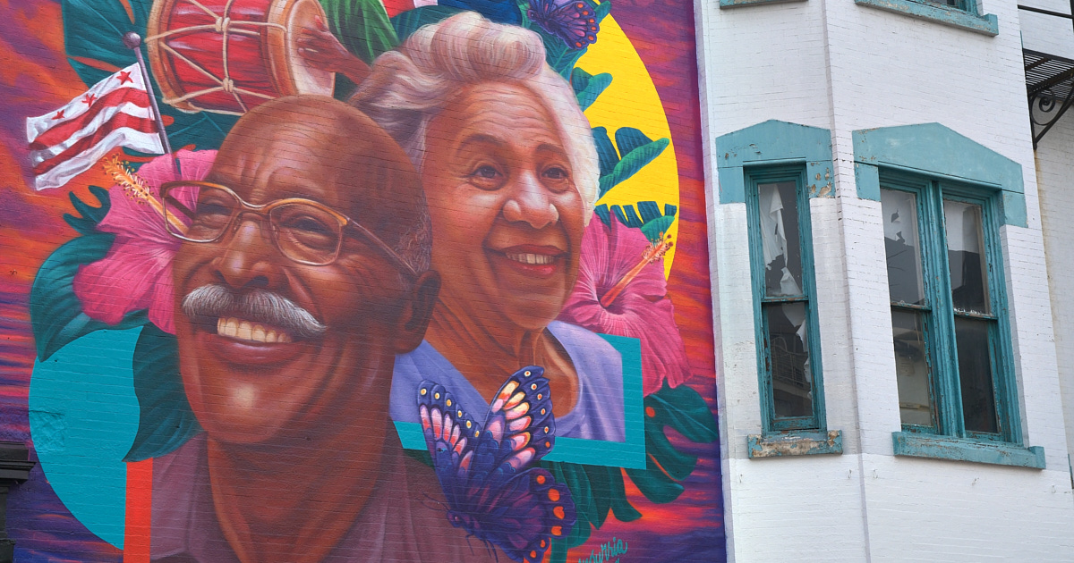 Happy couple graces a building on 14th St