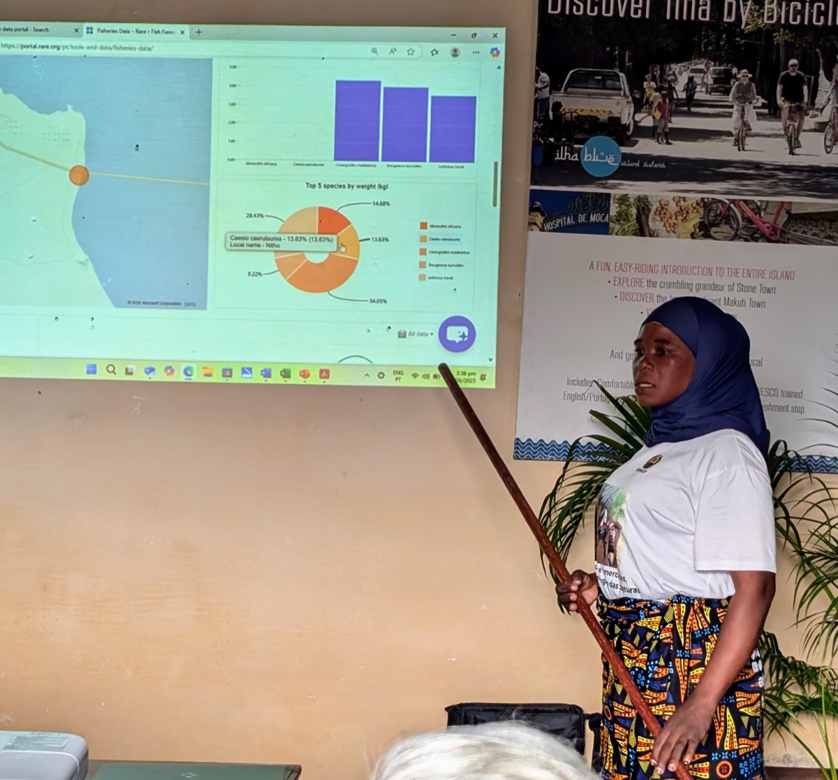 <# Woman at a presentation explaining the use of data  #>