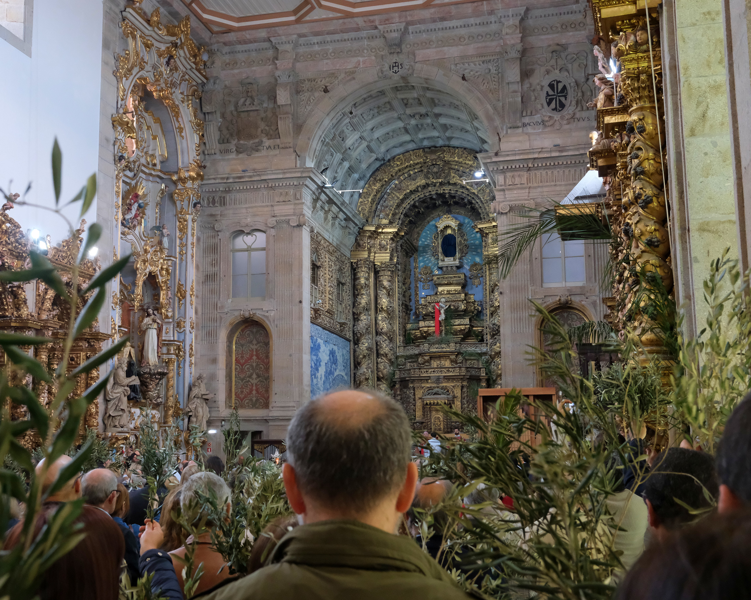 <# Church full of people carrying olive branches #>