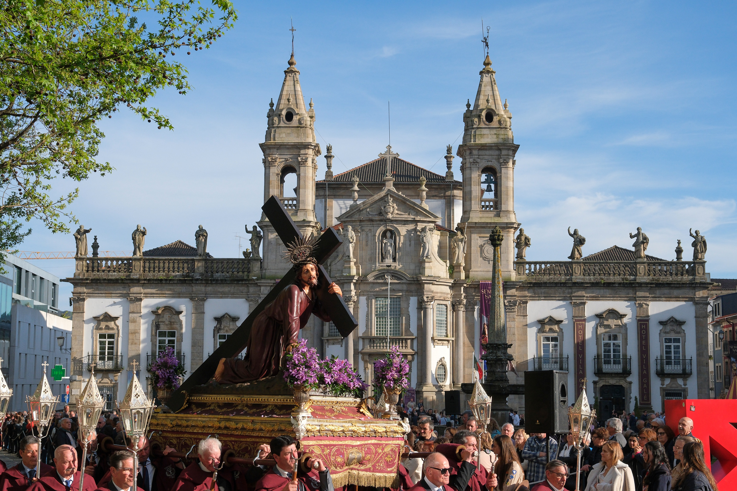<# a float carrying Jesus, who carries the cross, as it passes through town center #>